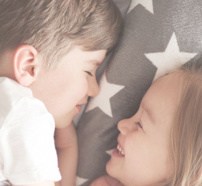 Two children nose to nose